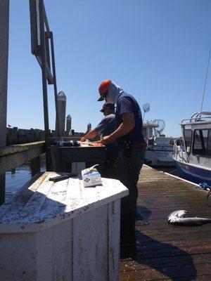 Jeff and Ryan filleting the fish.