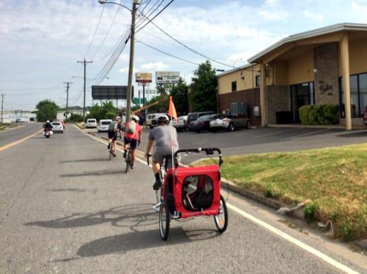 Bailey Co owners biking into work at The Bailey Company on Cowan Street.