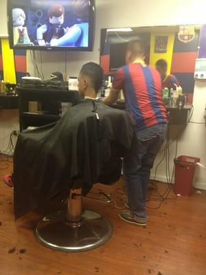 Peru cutting little brothers hair and its looking great!  @barberking10