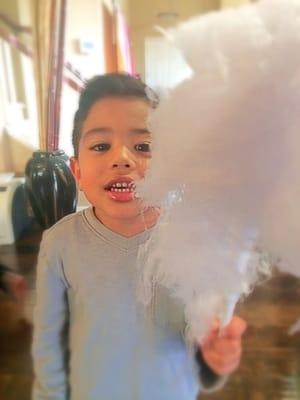 enjoying his cotton candy