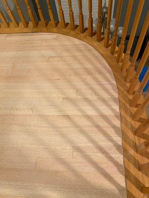 Our refinished landing!  How amazing it looks next to the staircase railing that was still the honey oak we were trying to get rid of