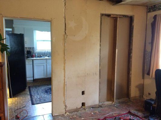 Before demolition: Wall between living area and kitchen