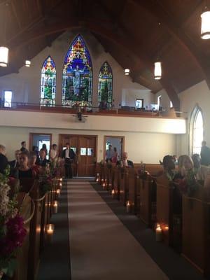 Cool view down the aisle. Nice stained glass!