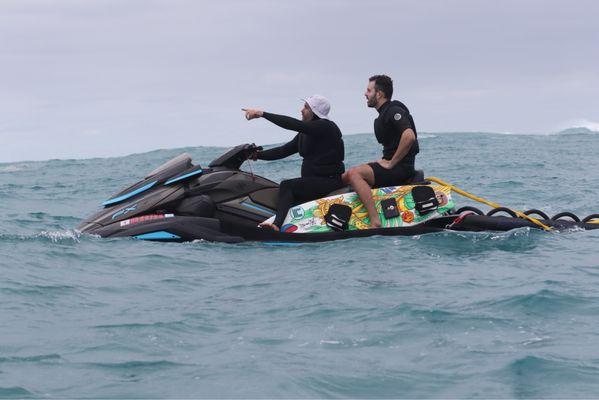 Tow in session at an outer reef on the north shore