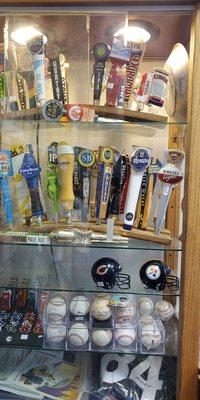 Autographed baseballs and beer tap handles