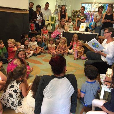 Miss Lynda reading the book all the kids made together titled " flyer the kite"