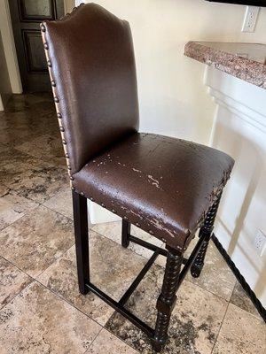 This is one of 2 chairs I need recovered with a leather like material on the front.