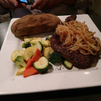 ribeye with string onions, baked sweet potato, and mixed vegetables