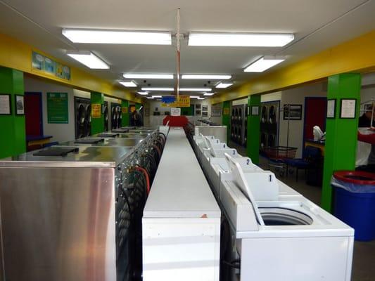 As you walk into the laundromat this is what you'll see. Multiple sized washing machines from smaller up front to larger in the back.