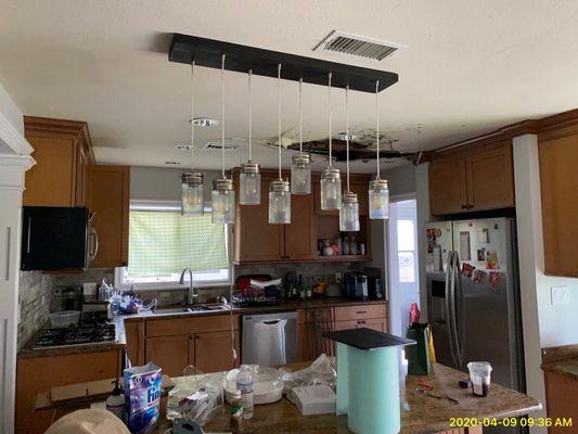 Kitchen damaged from water leak above ceiling.