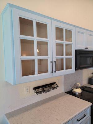 Custom glass cabinets, the trim work between panes is gorgeous.