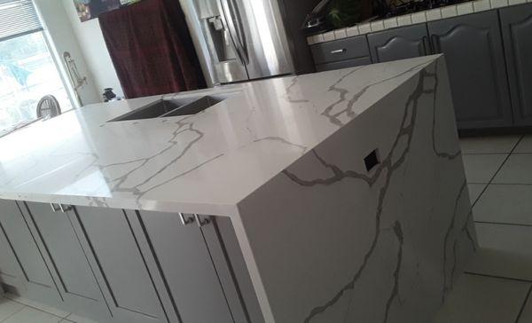 Quartz-Calacatta white 52" wide Island with both sides waterfall finished.