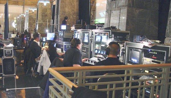 Backstage technical crew during live event production.