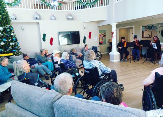 Students playing lovely music for our residents