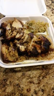 Large Jerk Chicken with rice and peas topped with oxtail gravy and cabbage