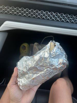 Burrito was handed over half open, food all over.