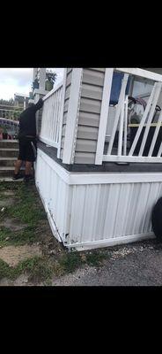 My porch was destroyed by the guy in the first photos tow truck who j&d sent out to pick up my car I was selling.