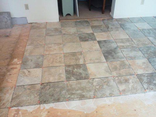 Laying tile flooring