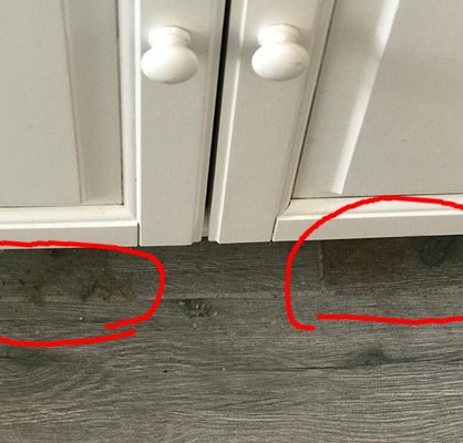 Other side of linen closet wall leak - coming from apt above leaking behind wall under "vanity" and out bottom staining tiles!