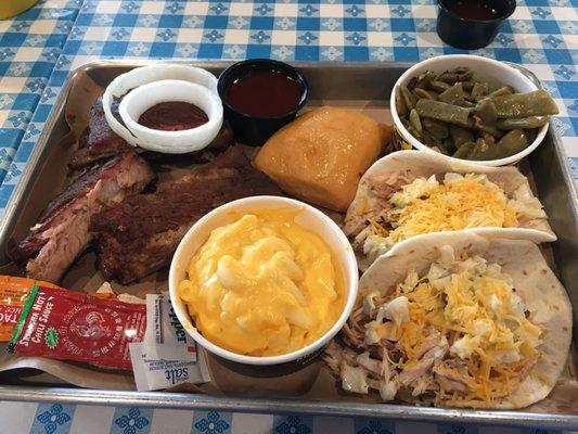 My 1 meat plate of baby back ribs. We split another special, Stiracha Chicken Tacos.  2 for $3. With coleslaw and cheese = chicken salad.