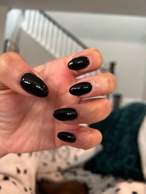 Black nails with acrylic overlay. Look fine but not worth price. Also you can see cuticles are irritated and there is black polish residue.