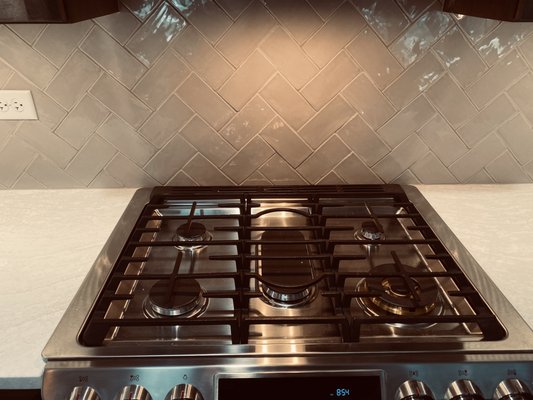 Kitchen herringbone backsplash.