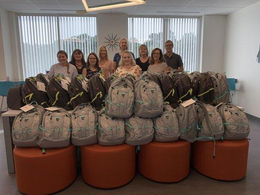 Martin & Jones donated 45 backpacks filled with school supplies for high school students.