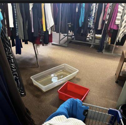 the photos show water in bins  on floor from broken tiles in ceiling where customers can  fall and break a leg