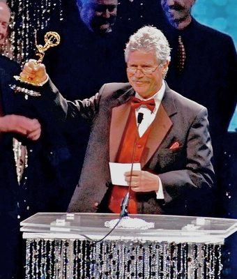 Brown receiving the first of his three Emmy Awards.