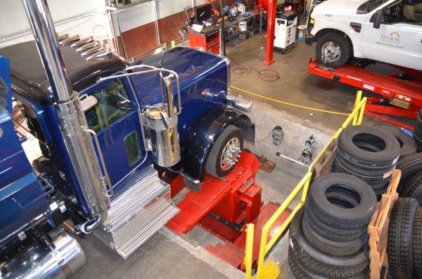 Alignment Pit to expertly diagnose suspension and and for multi axle alignments.