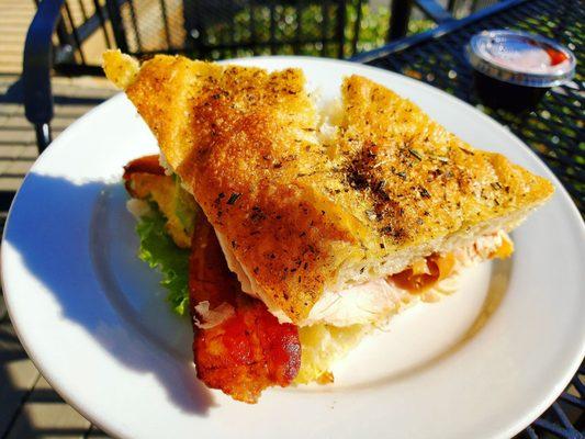 The Helena. Turkey, bacon, avocado, fried egg, lettuce, tomato and scallion mayo on herb focaccia.