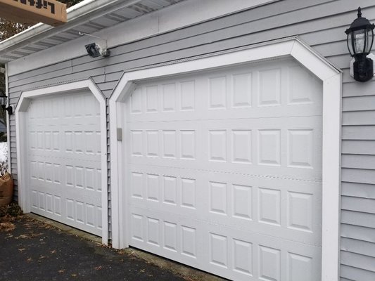 A pair of 8'×7' Amarr Oak Summit 2000 garage doors. Pretty low cost, and they look great!