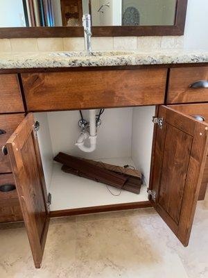 Wooden blinds stuffed in cabinet and not rehung.