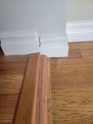 The other side of the walk thru baseboard installation. Dong claimed this was professional and the way it should be done.