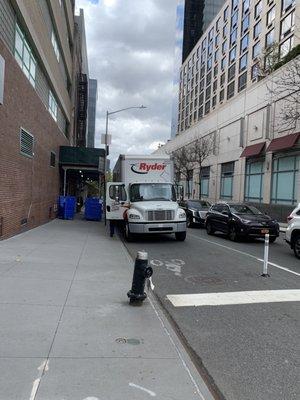 Goodwill delivery truck illegally parked in a bike lane while unloading.