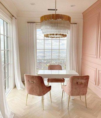 Soft Rouge drapes with Velvet chairs. Gold brass chandelier gives this office a touch of elegance and luxury!