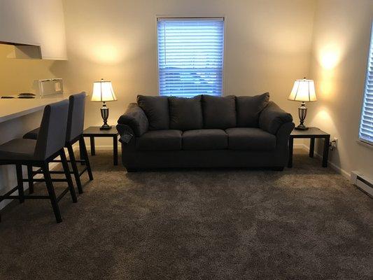 Living room with bar to kitchen.