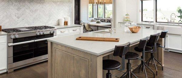 This beautiful, warm, & inviting kitchen is featuring MSI Calacatta Vicenza quartz countertops with a matte finish.