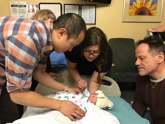 Teaching a new family how to swaddle right after the birth of their first baby girl. *Picture posted with families approval*