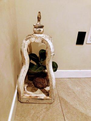 Plant and container decor in corner