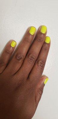 Neon yellow polish and manicure