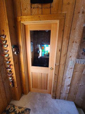 We installed a new door to seal airflow between the mudroom and the house.