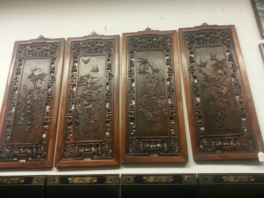 Wood carvings wall hangings.  On my wish list.