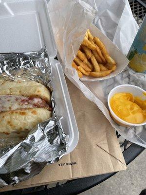 Chicken parm sandwich with cheese fries.