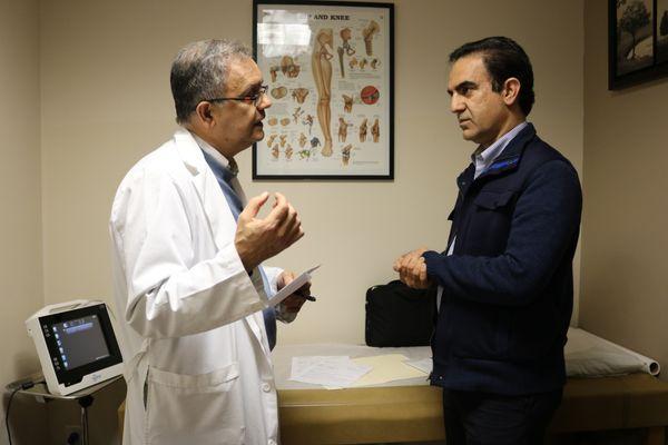 Dr. Moheimani and a patient discuss the benefits of PRP therapy.