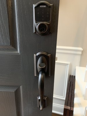 Schlage electronic lock and door handle installation.