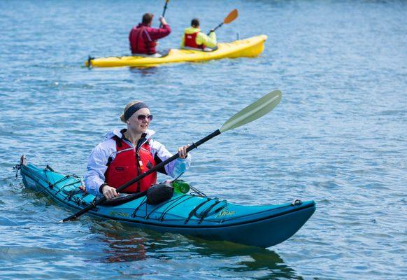 Most participants are in tandem kayaks while some are in singles.