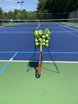 Practicing my serve on the new courts.