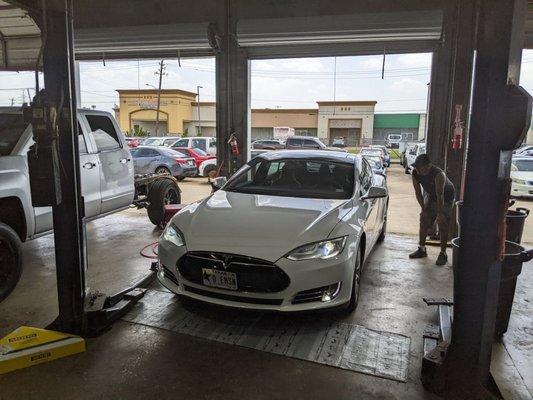 Tesla being repaired in auto body shop Houston Texas