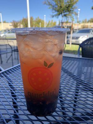 Peach rose tea with boba, under $5 cheap but it's very much just syrup